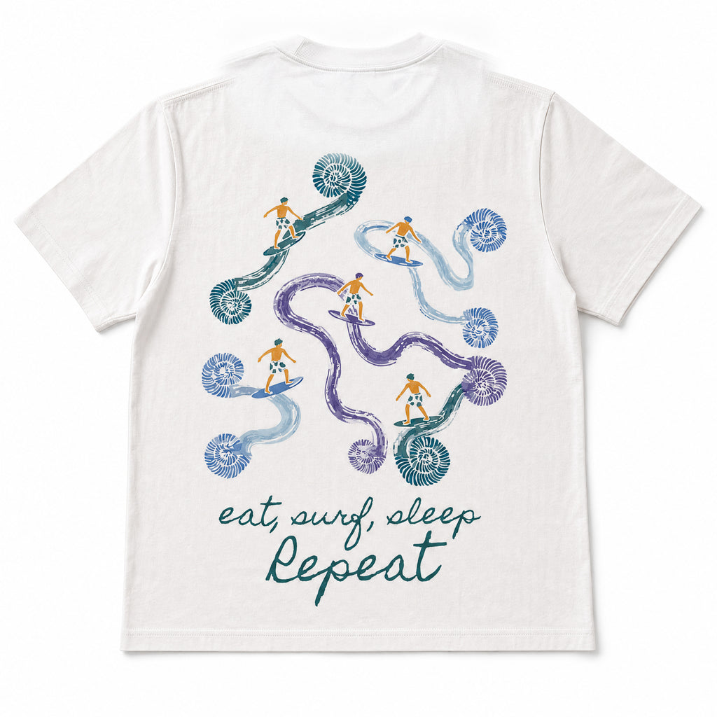 Surf Repeat Tee back — embroidered surfer and ammonite artwork