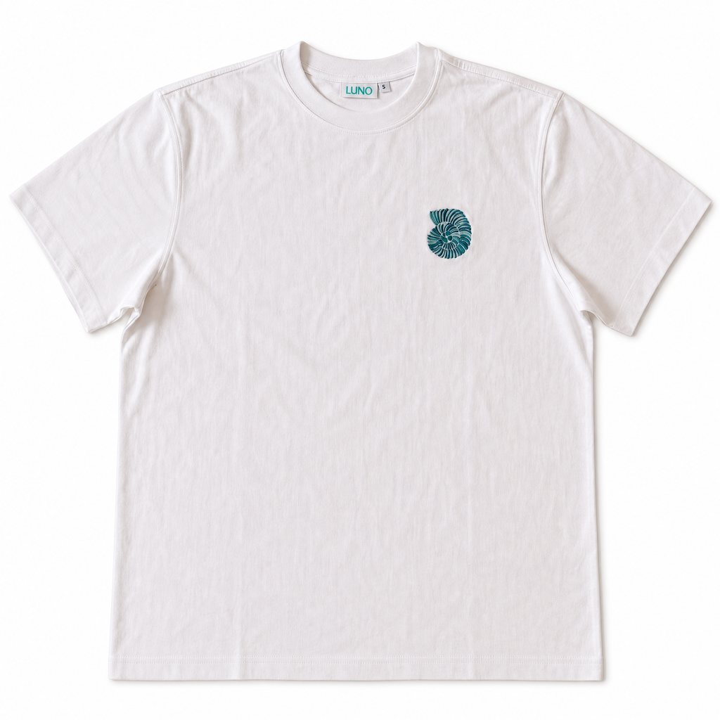 Surf Repeat Tee front — teal ammonite embroidery